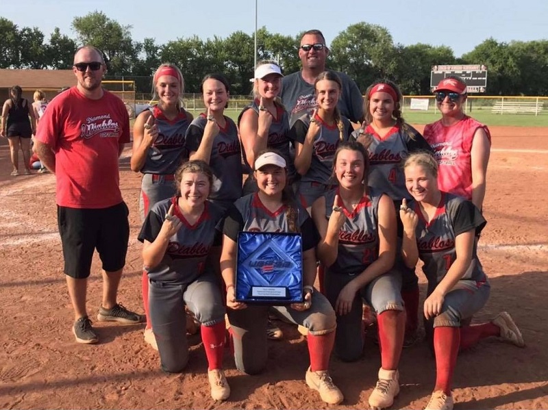 The Russell 18 and Under Diamond Diablos pose with their plaque after winning the USSSA 18 and Under National Championship on July 24, 2021 at the Two Rivers Youth Complex in Wichita, Kansas.