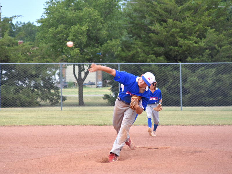 Russell's Mason Rohr pitches against Goodland on Sunday, July 24 in the semifinals of the K-18 State Baseball Tournament in Lucas. (Photo by Rita Sharp, Lucas-Sylvan News)