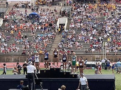 Victoria's Macy Hammerschmidt stands atop the medal podium after winning her third consecutive Class 1A High Jump State Championship on Saturday, May 27 at Cessna Stadium in Wichita.  (Photo courtesy of Amy Schoenrock).