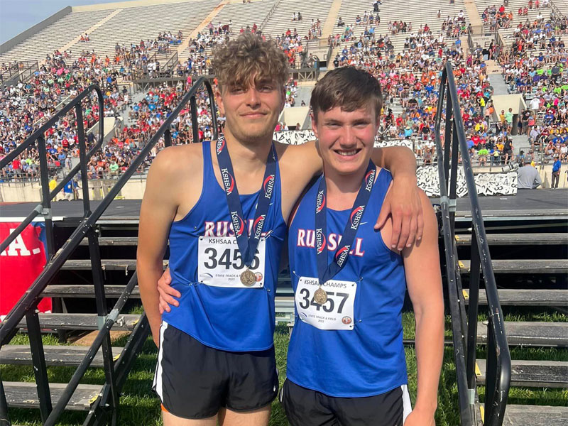 Jace Peerman (left) and Brayden Strobel of Russell High School celebrate on Friday, May 26 after Strobel won the Class 3A State High Jump Championship and Peerman finished third at the Class 3A State Track and Field Meet at Cessna Stadium in Wichita. (Photo Courtesy of Sports in Kansas).