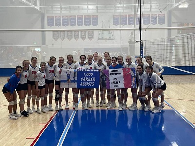 Russell High School Volleyball celebrates two milestones on Senior Night.  Marissa Myers surpasses 1,000 career assists and Anna Thielen surpasses 500 career digs. (Photo courtesy of RHS Volleyball).
