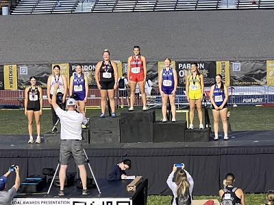 Russell High School's Macy Patterson (far right) is honored on the podium after placing seventh in the Discus Throw at the KSHSAA Class 3A State Track and Field Meet at Cessna Stadium in Wichita on Friday, May 24, 2024. (Photo Courtesy of Russell High School).