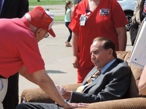 Bob Dole visiting during dedication of VA Mobile Bus Ceremony in Russell.