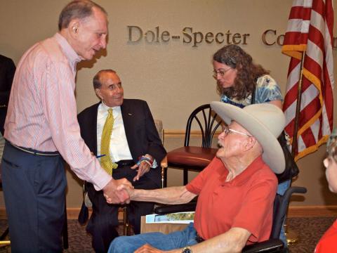 During the 2011 Prairiesta in Russell, Bob Dole visited with Arlen Specter and Dean Banker.